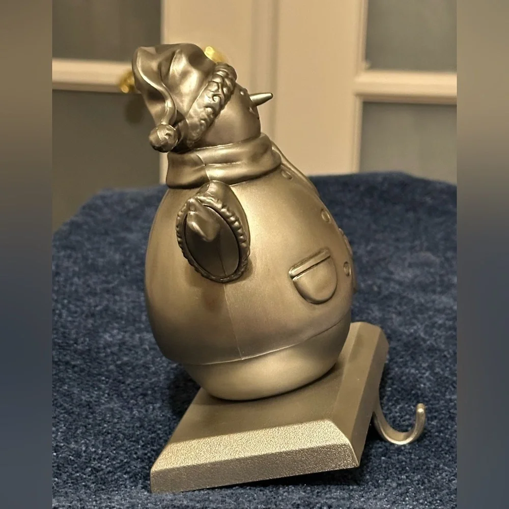 Silver snowman stocking holder. So cute!